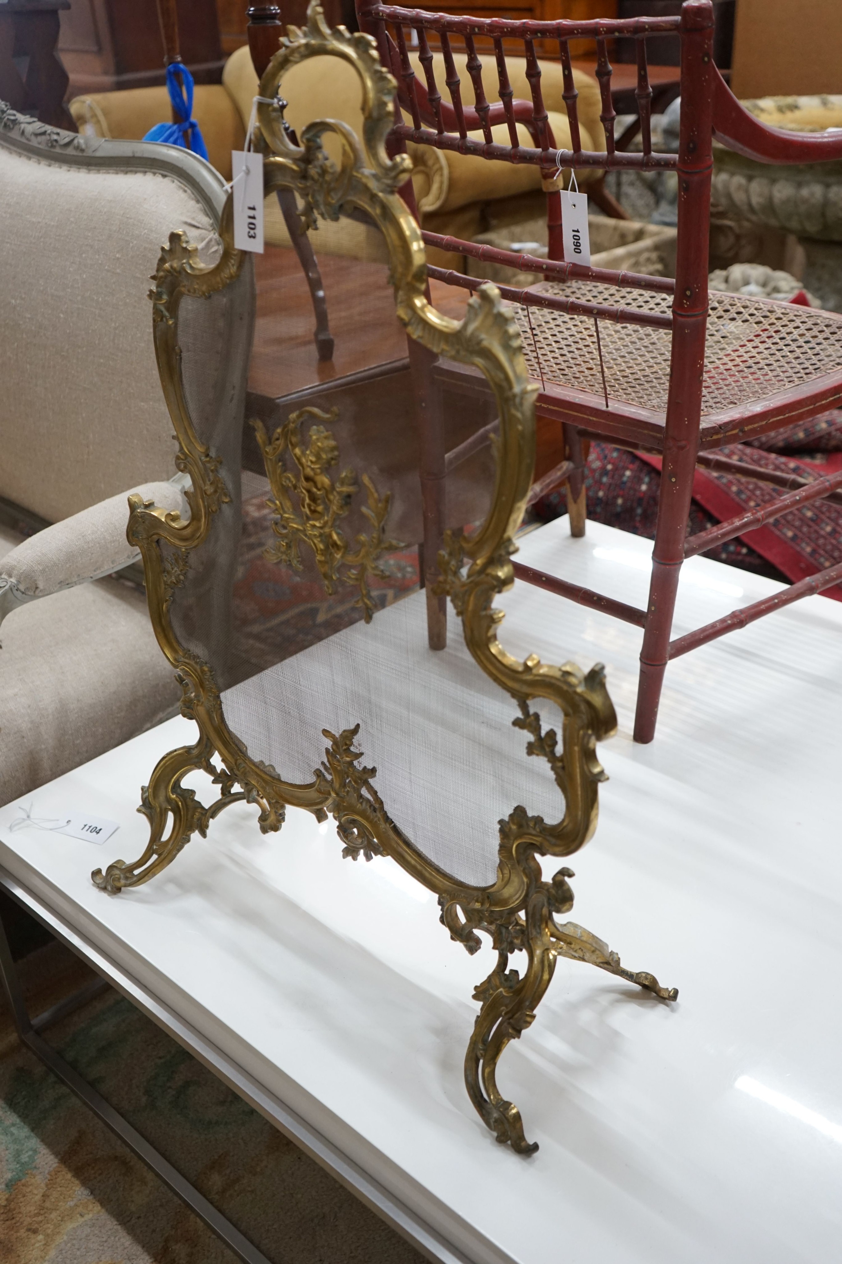 A Rococo style gilt metal mesh firescreen, width 58cm, height 82cm